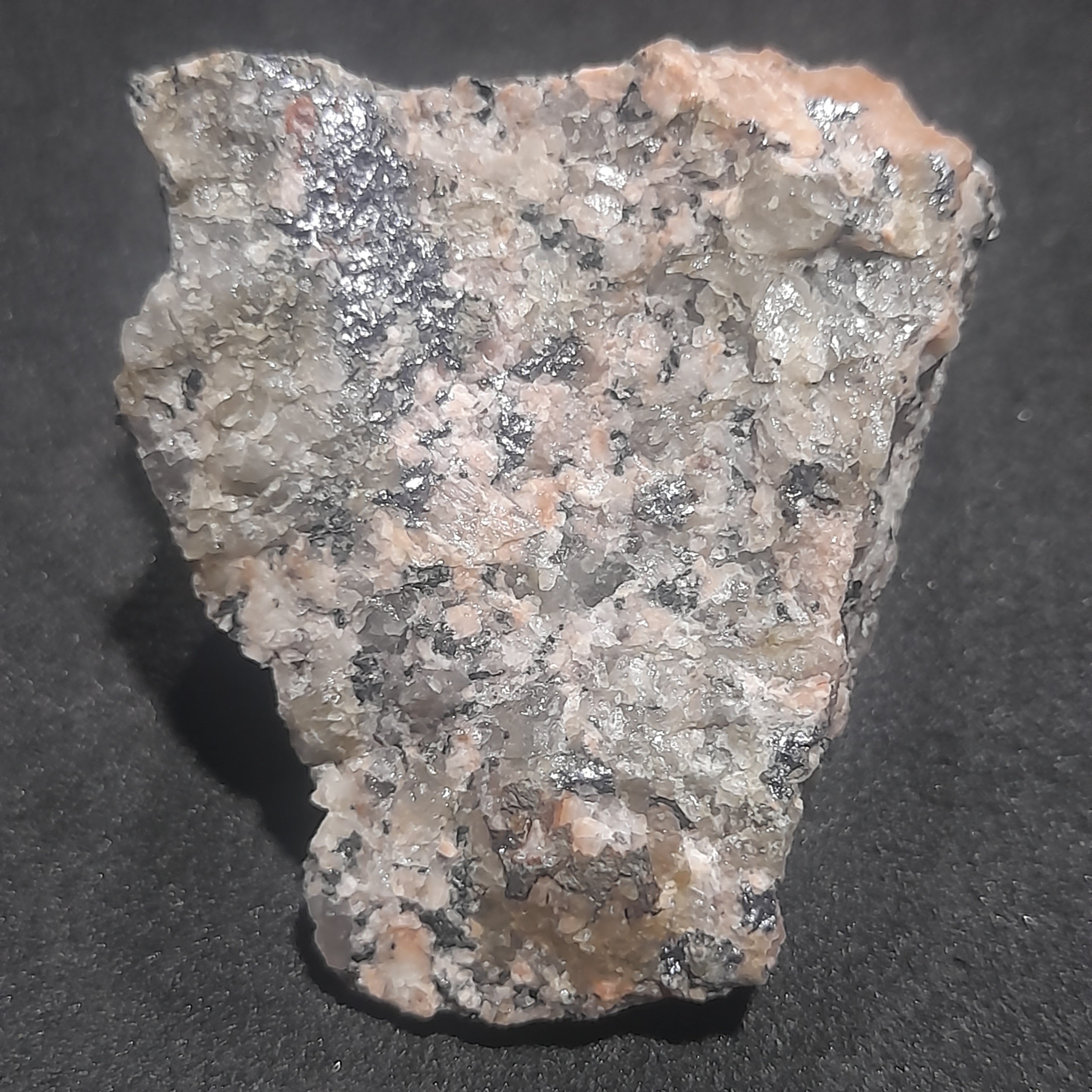 Molybdenite in granite with minor pyrites