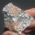 Molybdenite in granite with minor pyrites